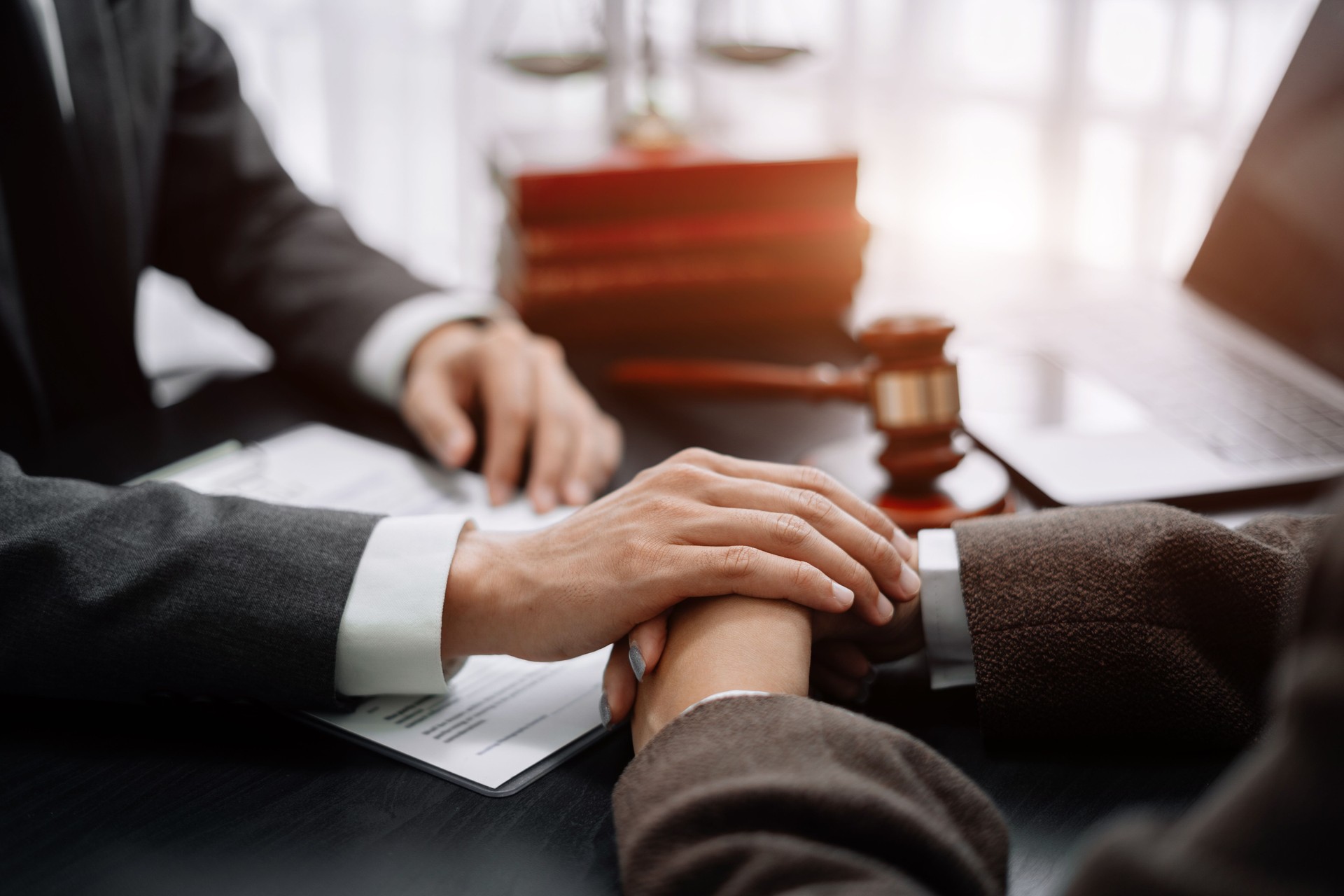 Legal advisers encourage clients. Justice and lawyer concept in the office.